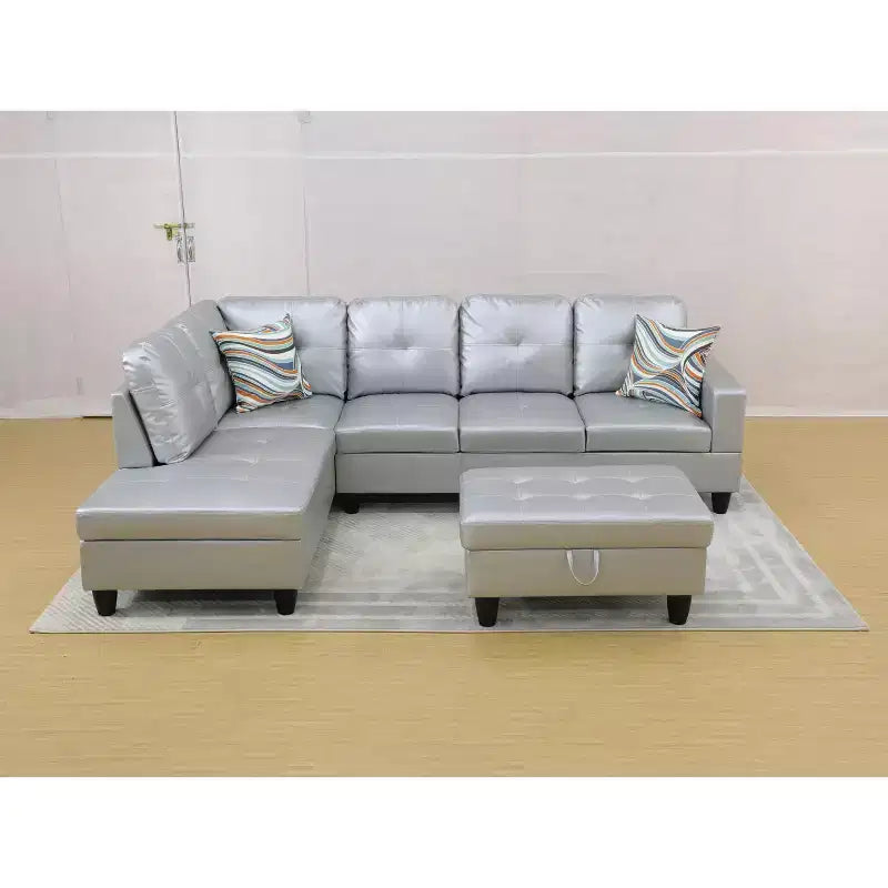 Divano componibile moderno in pelle grigia con pouf contenitore