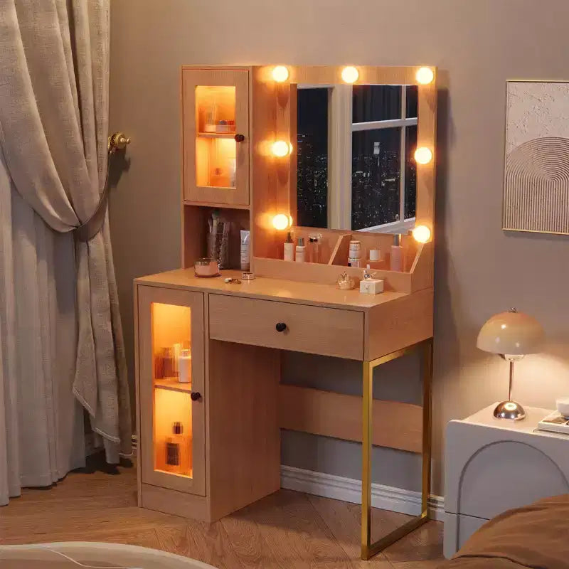 Toeletta con specchio, 3 modalità di illuminazione, prese di corrente e porte USB integrate, cassetti e mobiletto.