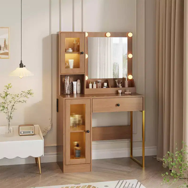 Toeletta con specchio, 3 modalità di illuminazione, prese di corrente e porte USB integrate, cassetti e mobiletto.